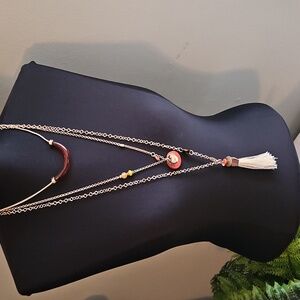 Chico's triple strand gold necklace.